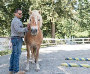 Rafael Estevez Marriage and Family Therapist next to horse